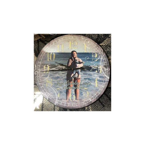 Memorial photo clock featuring a boy holding a fish beside the water