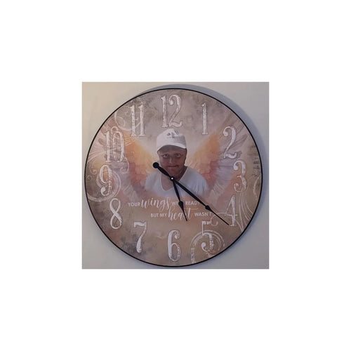 Memorial clock featuring a portrait of a man in a cap with angel wings