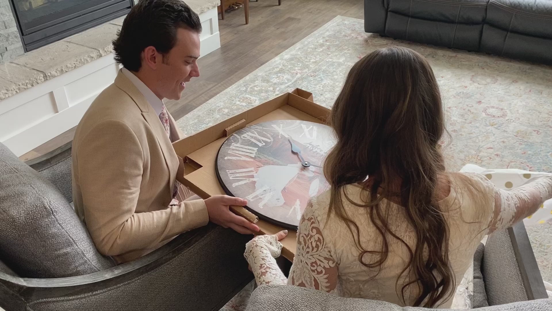Load video: Newly wed couple opens packaging to reveal their custom designed photo clock.